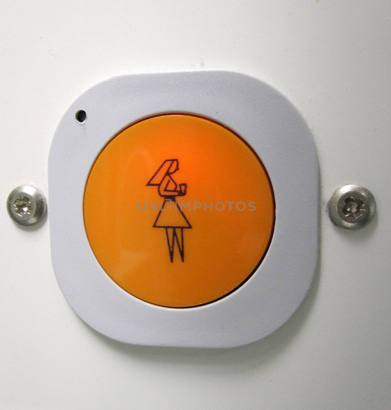 orange button in a hostpital to call the nurse for assistance