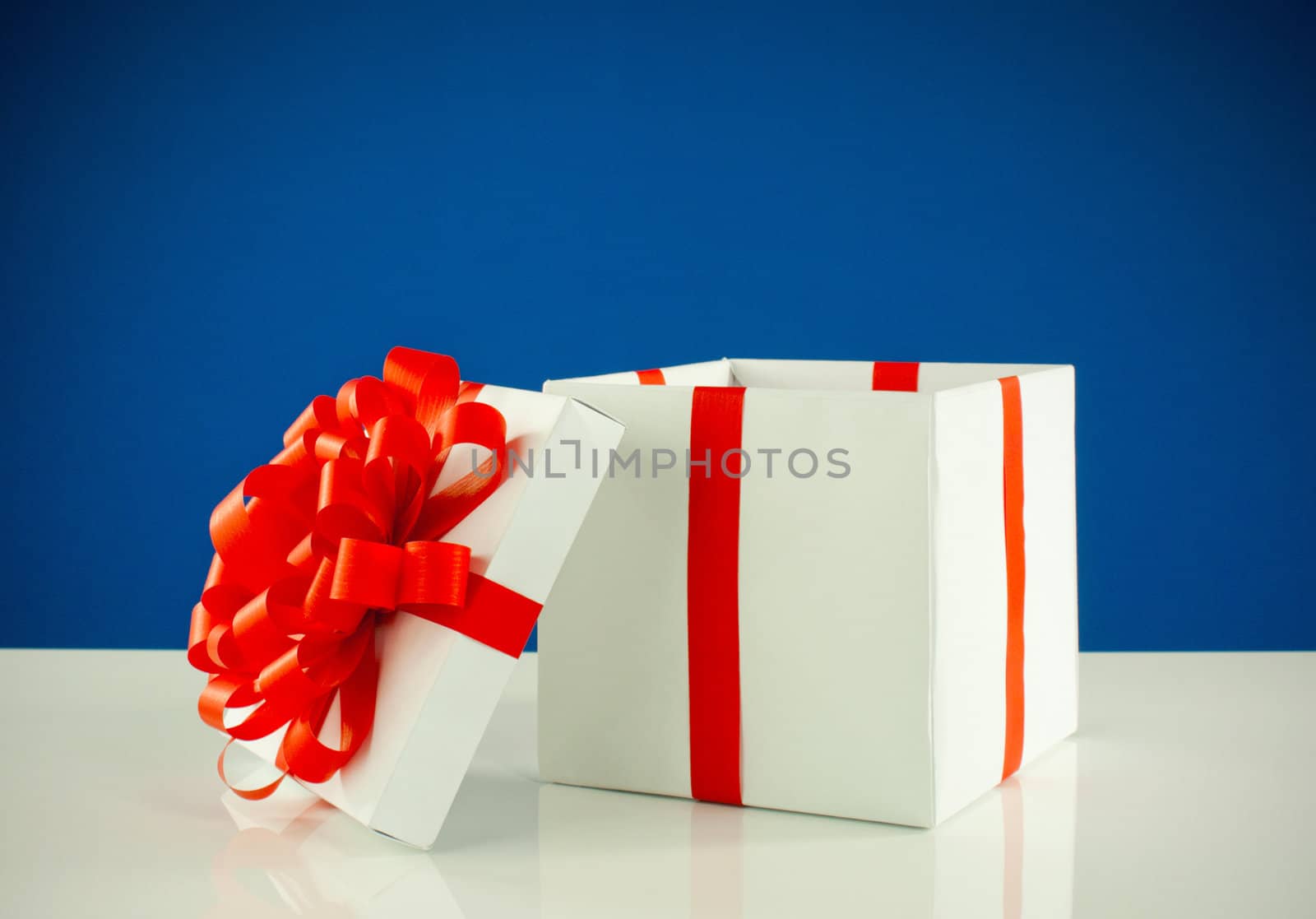 White box with present against blue background
