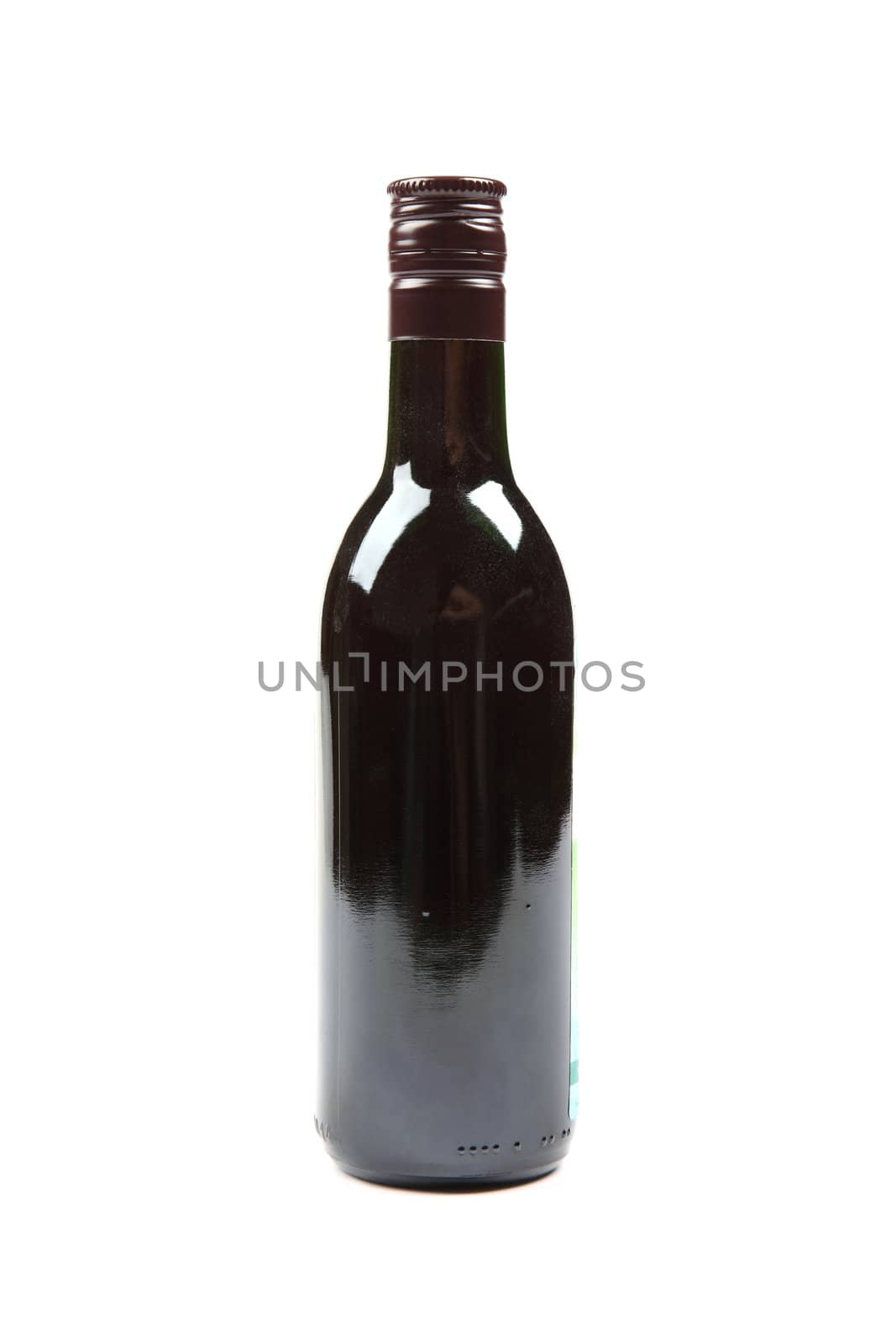 Small size full bottle of red wine isolated on white background.