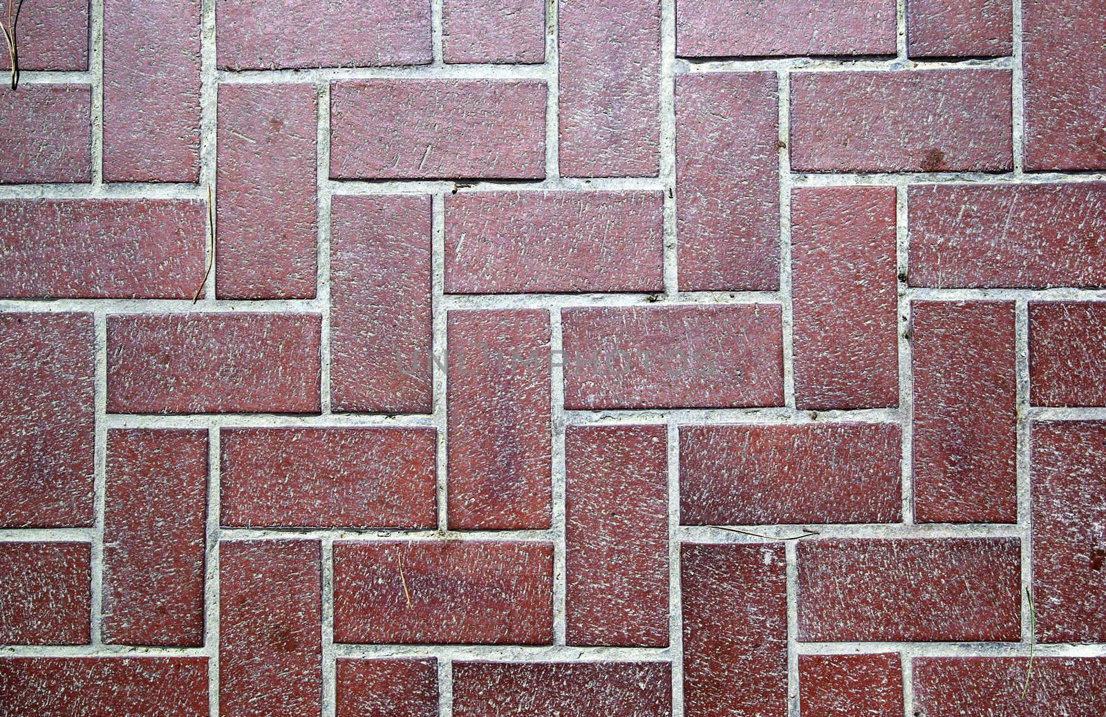 Floor tiled with red bricks. Good as backdrop or background.