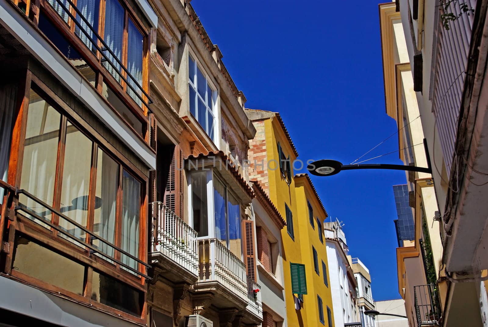 Typical narrow street of Lloret de Mar, Spain.