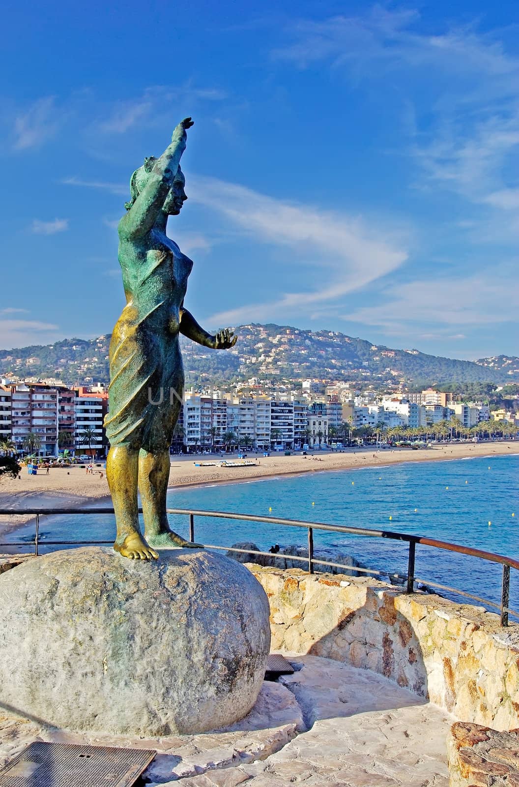 Bronze statue of woman looking to the sea. Lloret de Mar, Costa Brava, Spain.