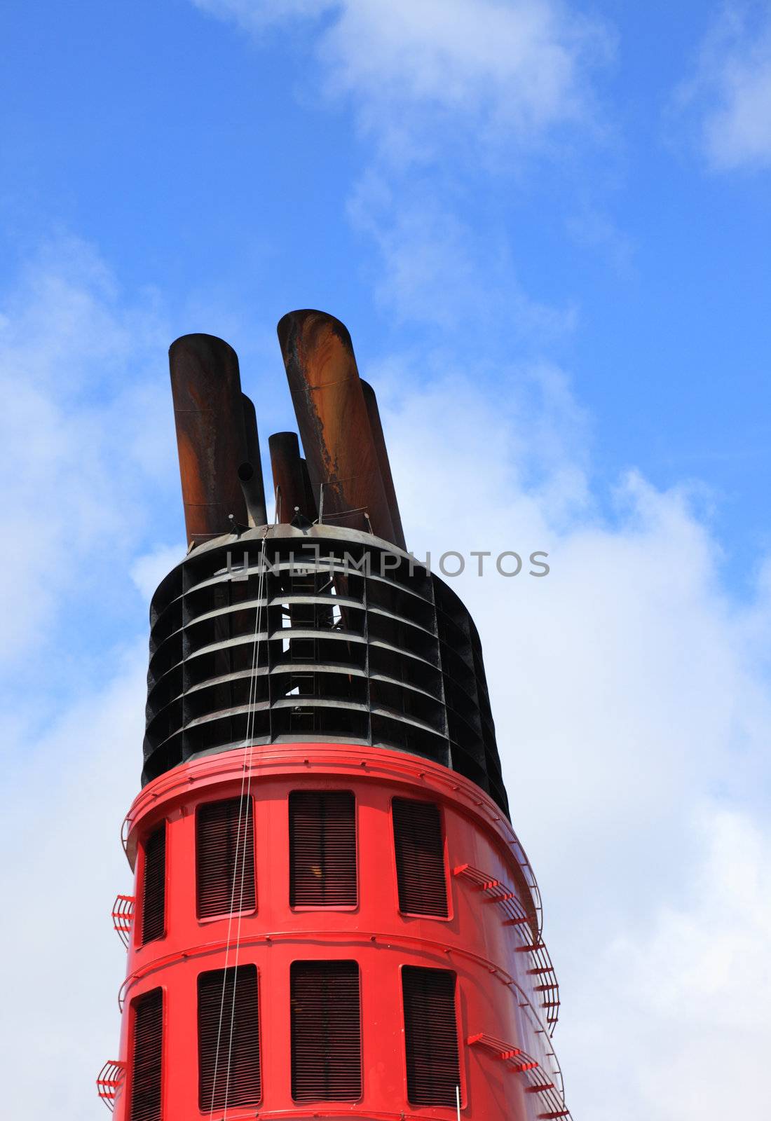 Chimney of big cruise ship and blue sky in background. by borodaev