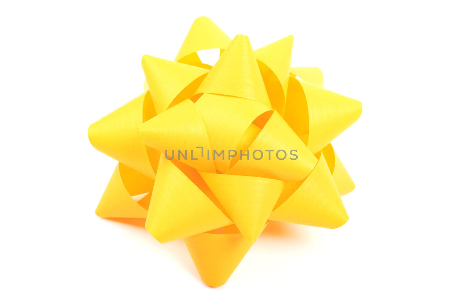 Yellow gift wrapping bow isolated on white background. by borodaev