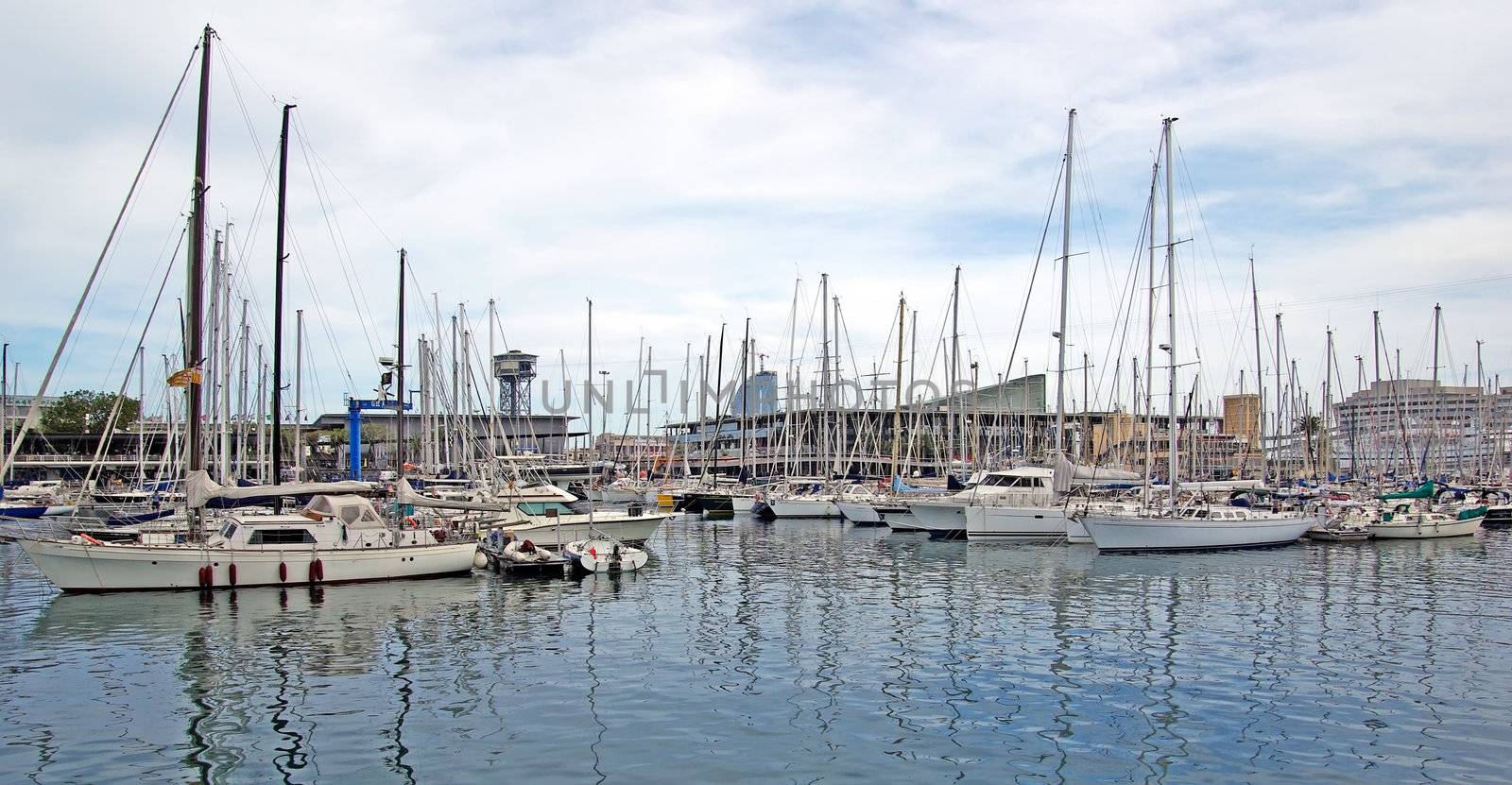 Yachts and sail boats in Barcelona harbour. by borodaev