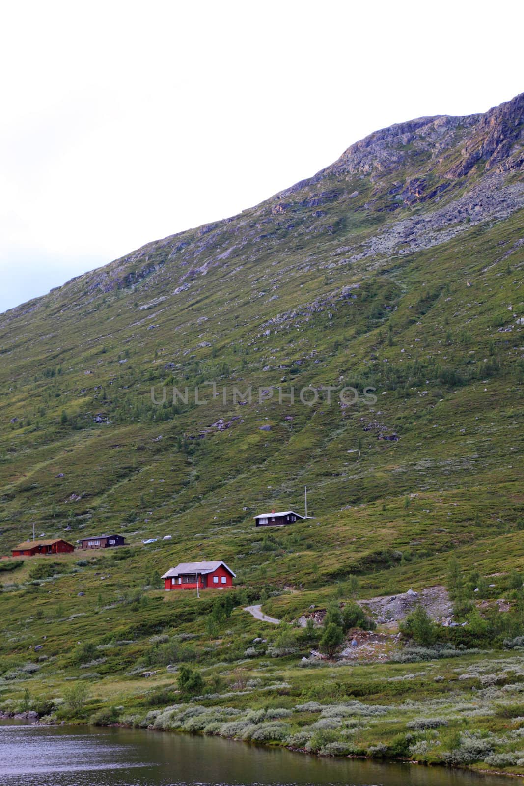 Mountain landscape with houses in Norway. Scandinavian Europe. by borodaev