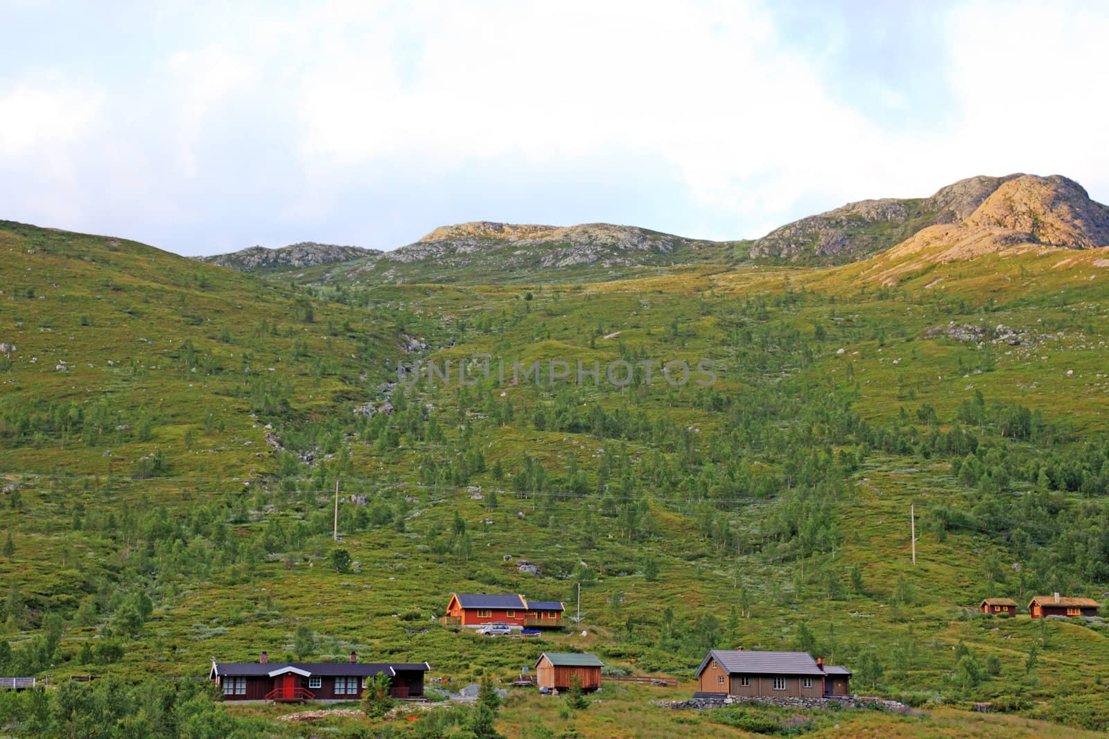 Mountain landscape with houses in Norway. Scandinavian Europe.