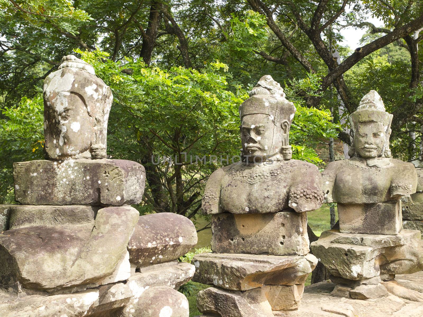 The ancient stone statue of Khmer god on the south gate of Angkor Thom, the world heritage site in Siem Reap province, Cambodia