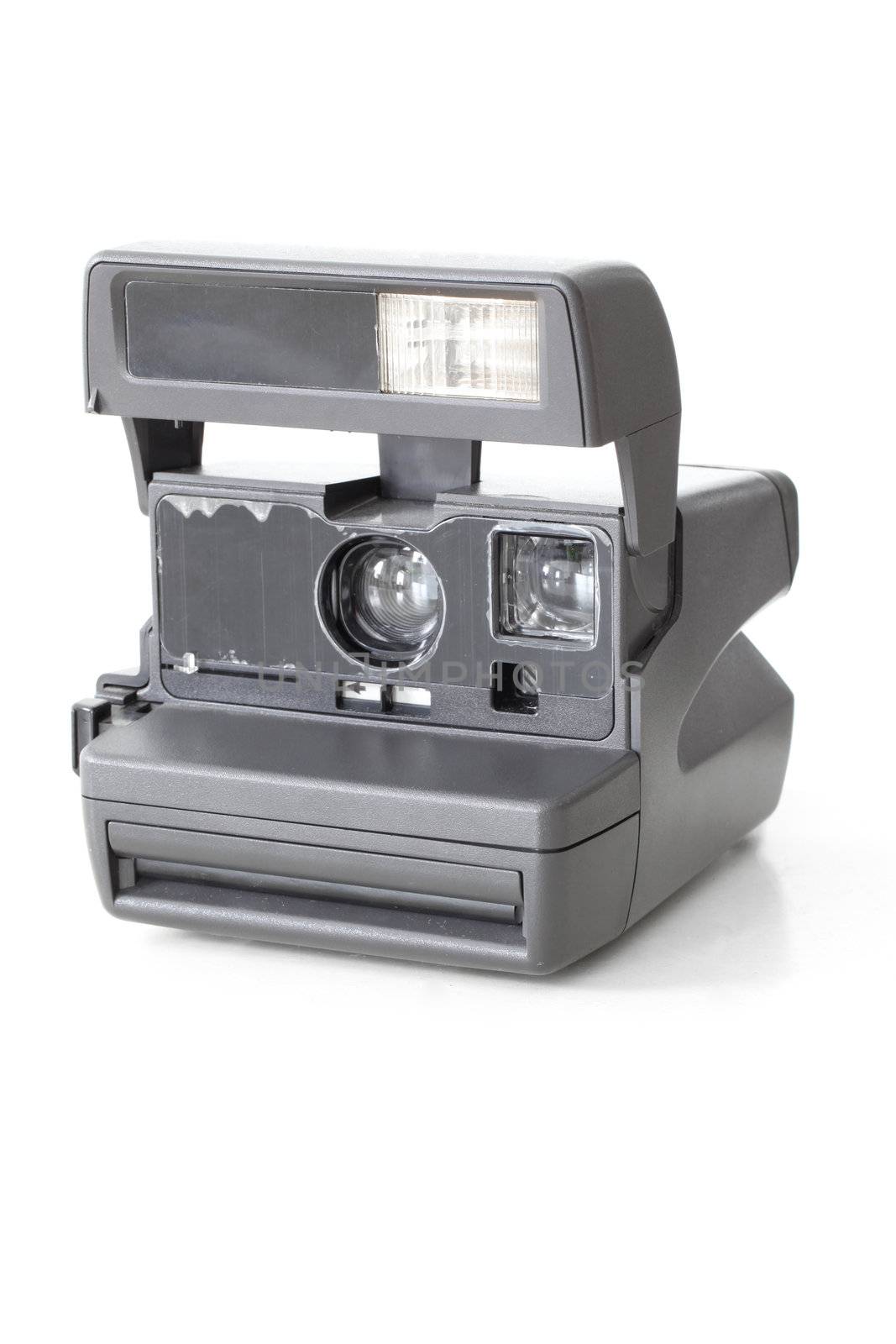 Vintage instant photo camera on white background