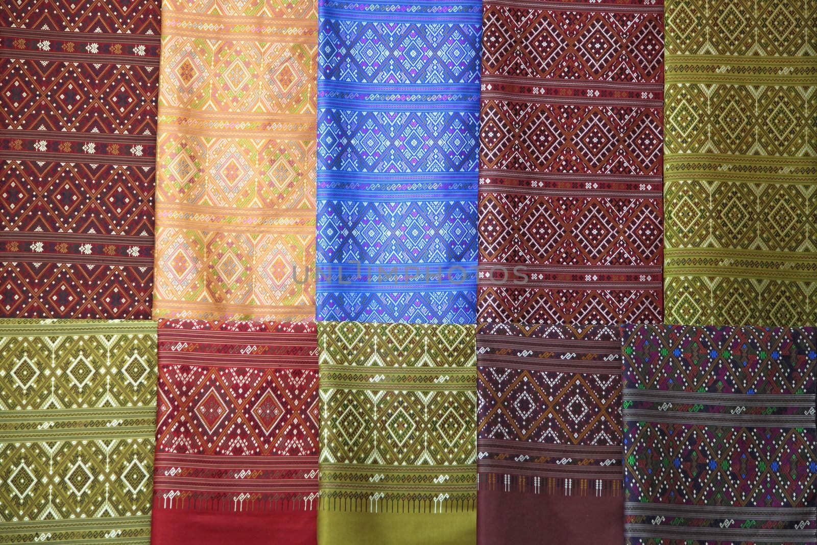pieces of colorful praewa silk fabric cloth using as background
