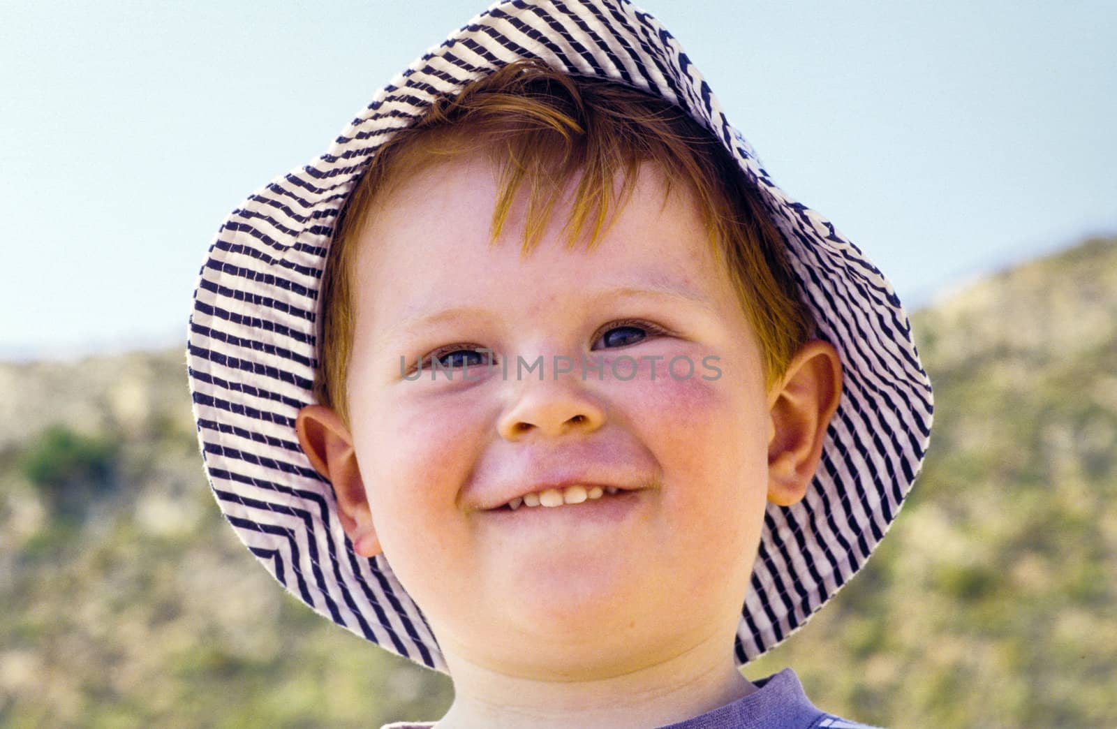 cute young child boy enjoys the beach