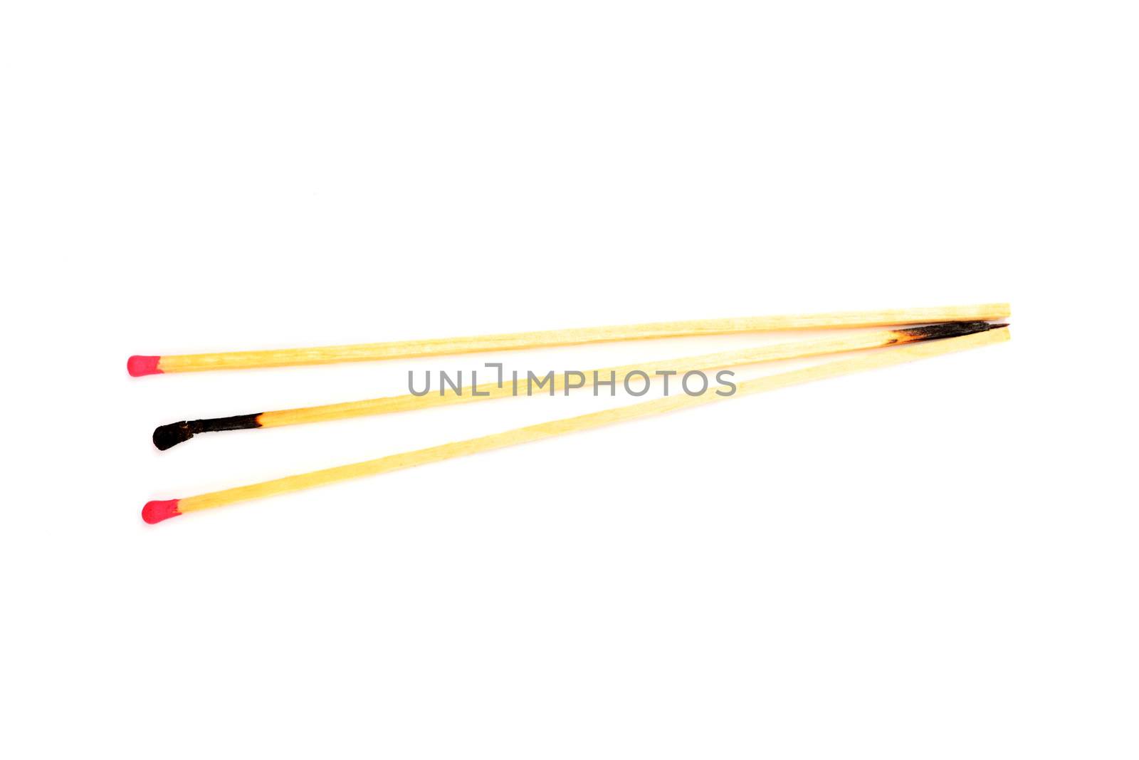 Three long matches isolated on white background. by borodaev