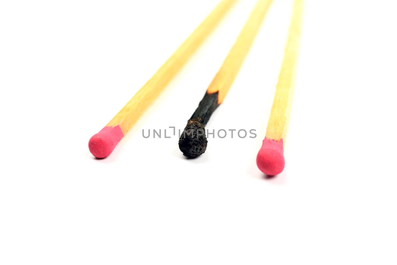 Close up of three long matches isolated on white background.