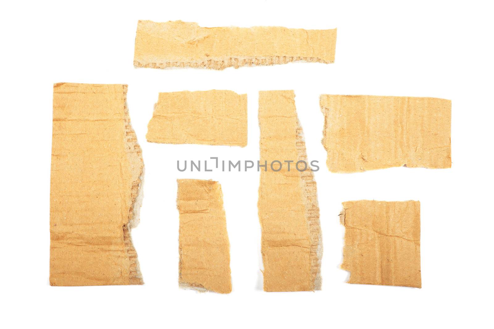 Torn cardboard isolated on white background. As textured backgro by borodaev