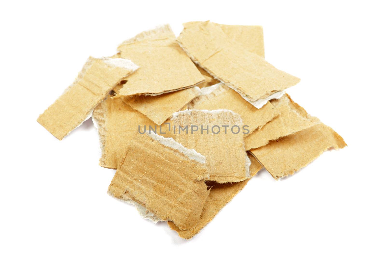 Heap of torned cardboard isolated on the white background. by borodaev