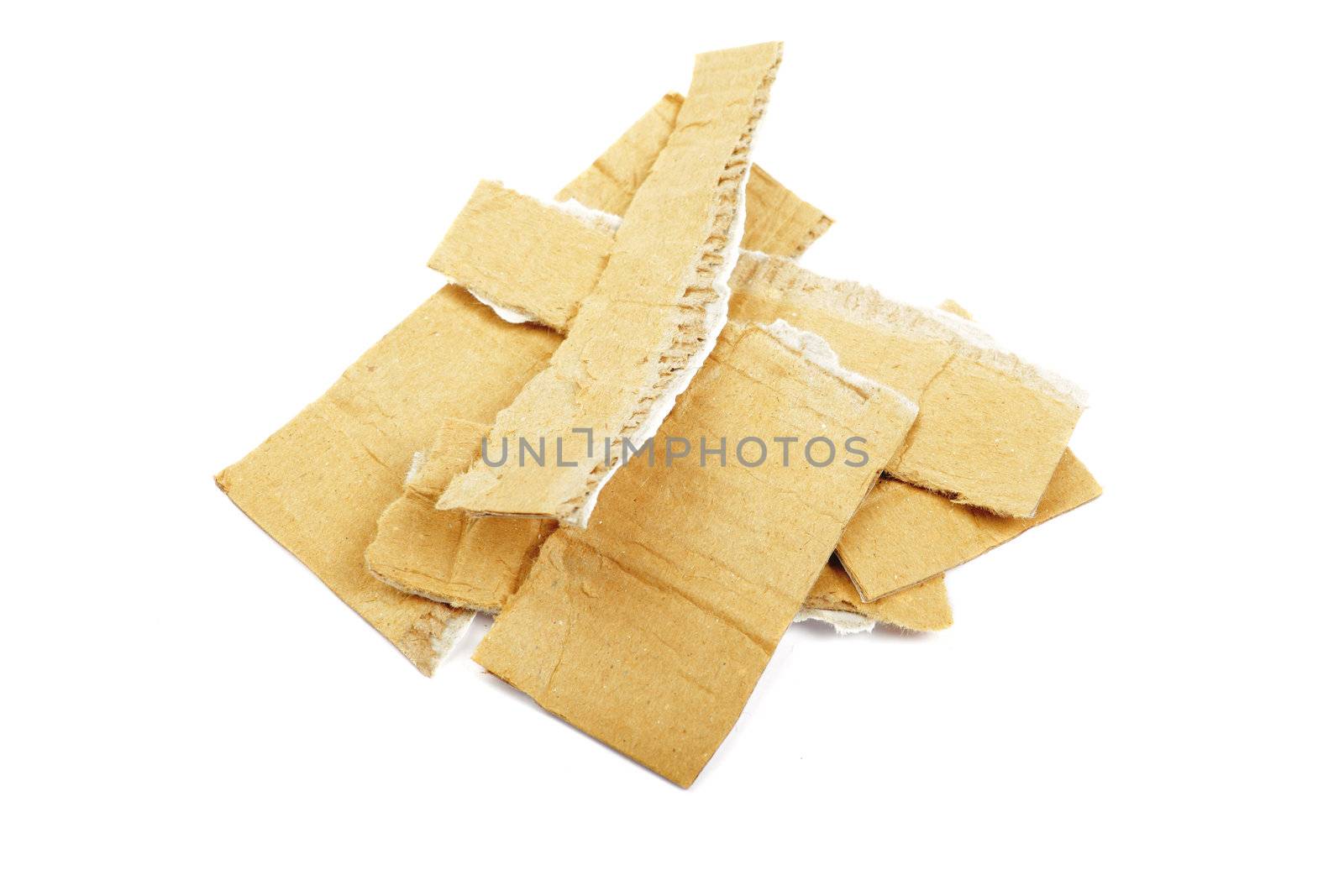 Heap of torned cardboard isolated on the white background.