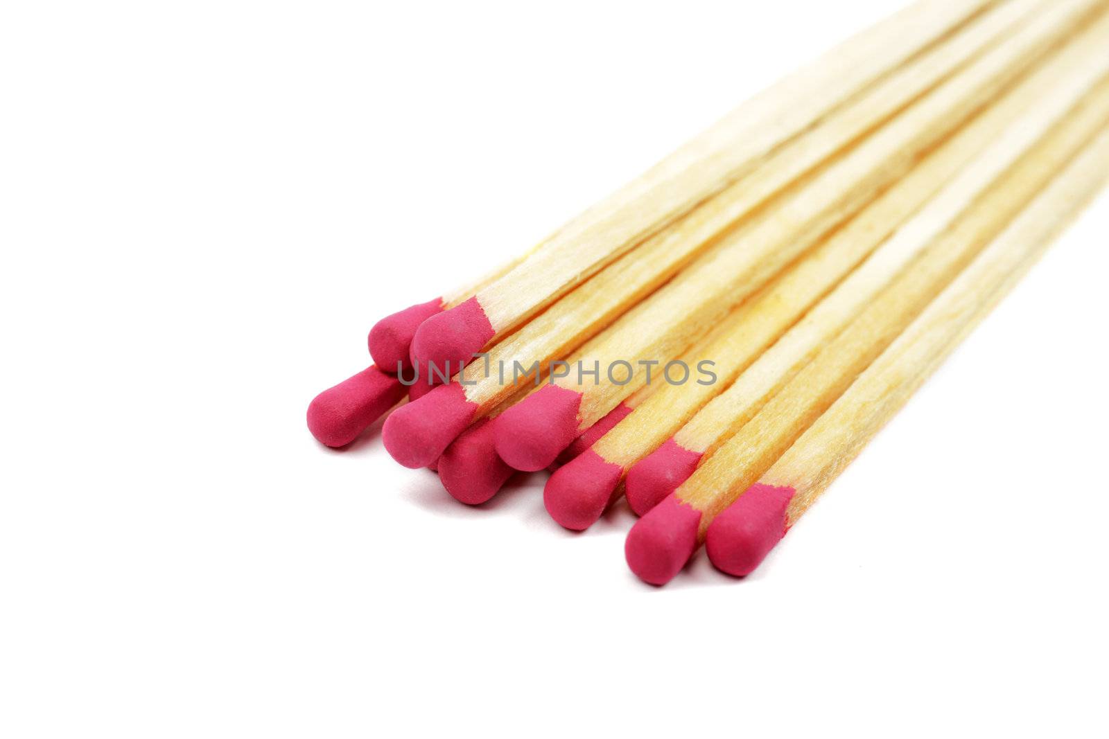 Heap of long wooden matches isolated on white background.