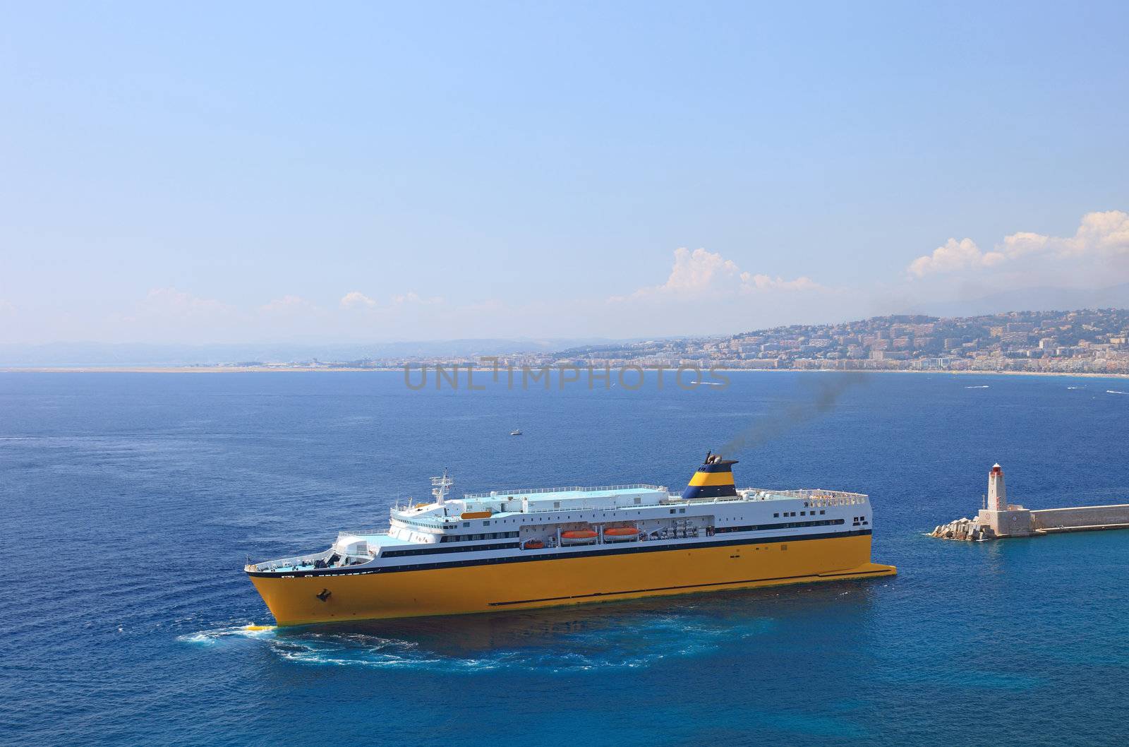 Big yellow cruise ship in port of the city of Nice. by borodaev