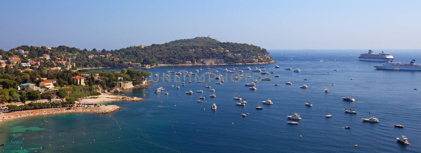 Panoramic view of bay near Nice city. Many sail boats, cruise ships.