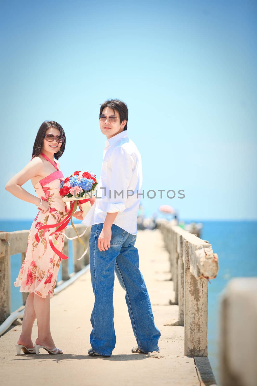 portrait of couples at pier on the beach by vichie81