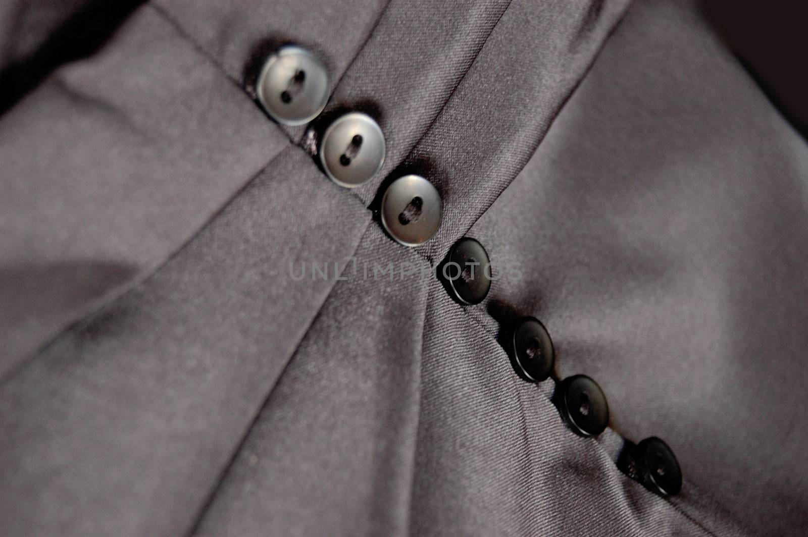 Part of silky skirt with buttons and folds
