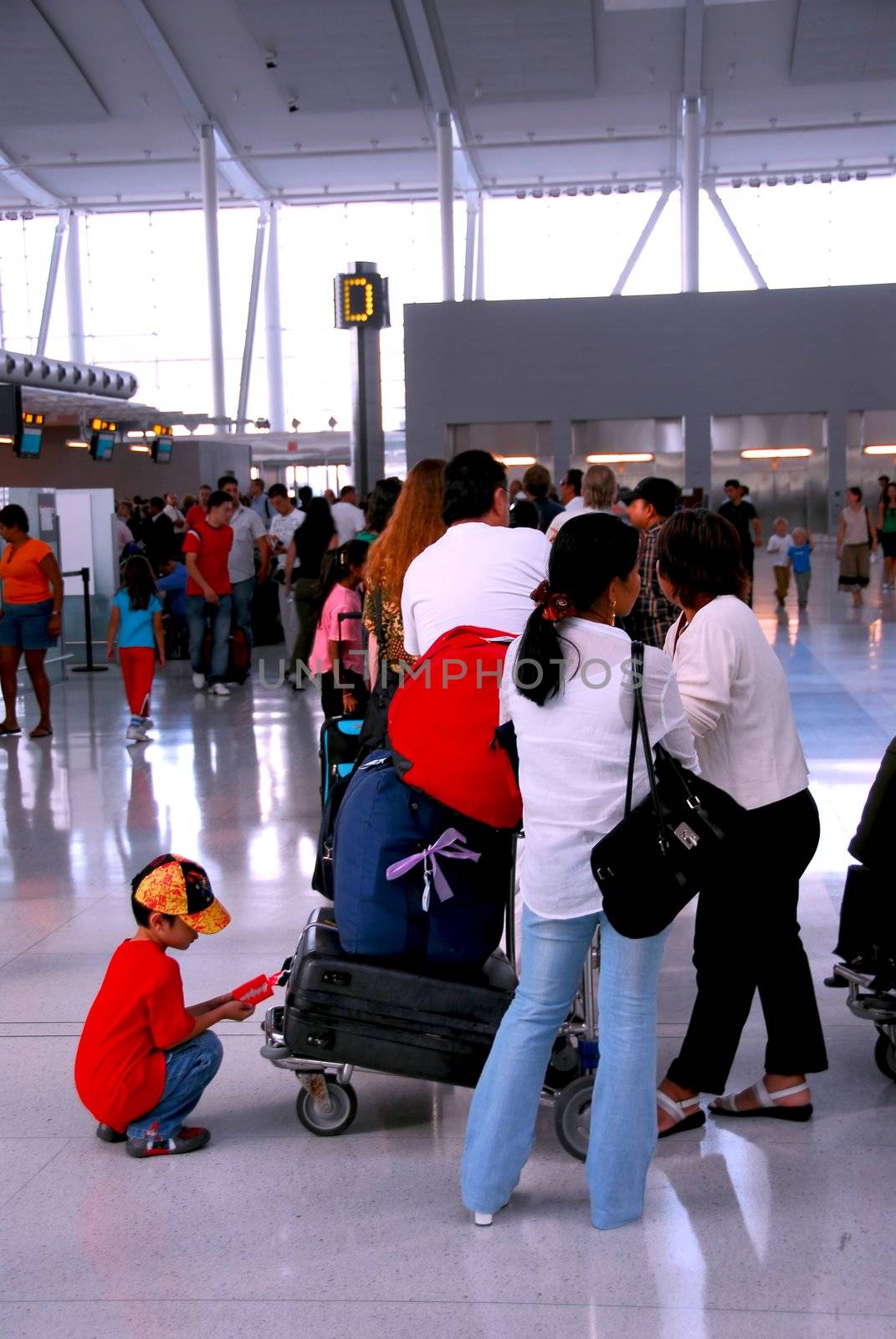 Long queue of people at modern international airport