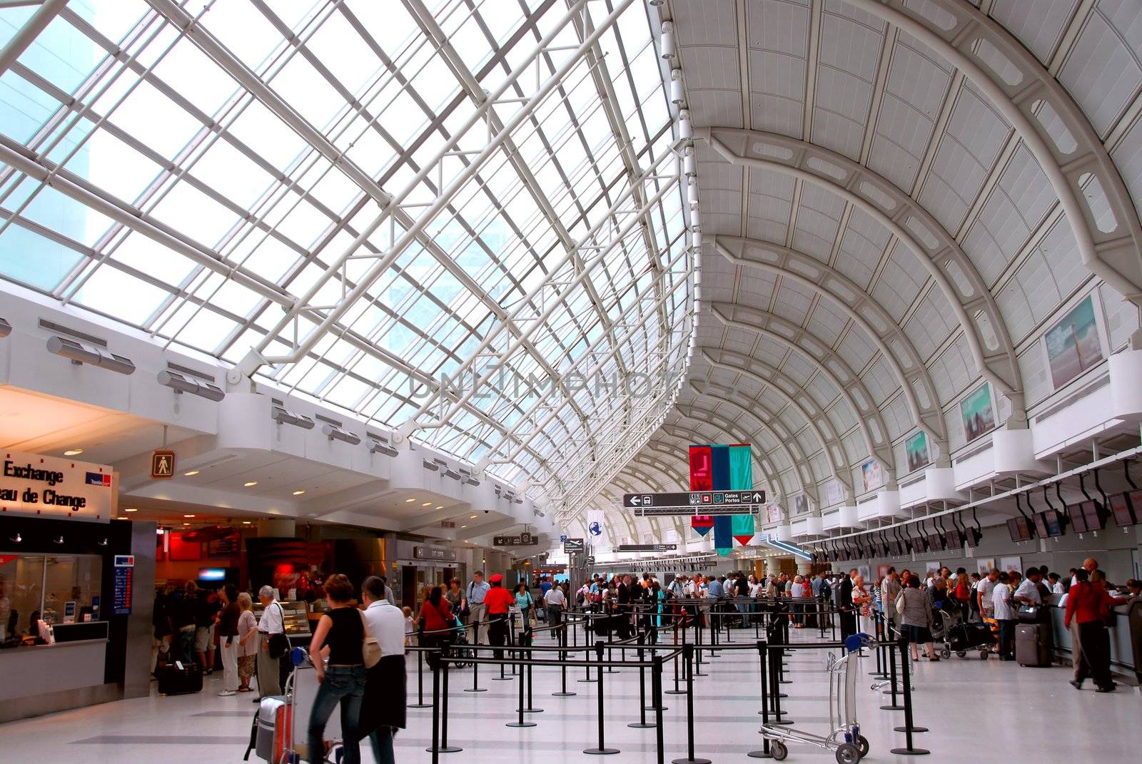 Passengers lining up at check-in counter at the modern international airport