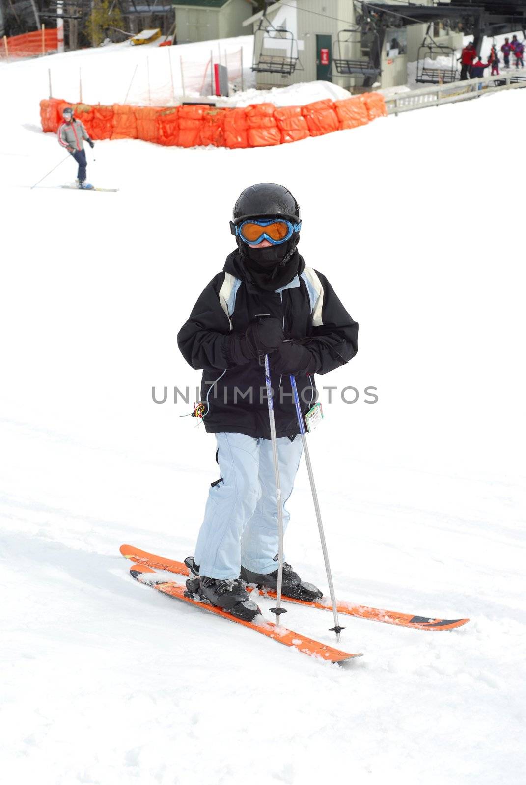 Young girl at downhill skiing resort
