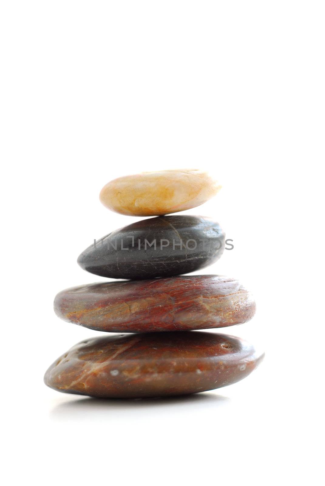 Stack of balanced stones isolated on white background