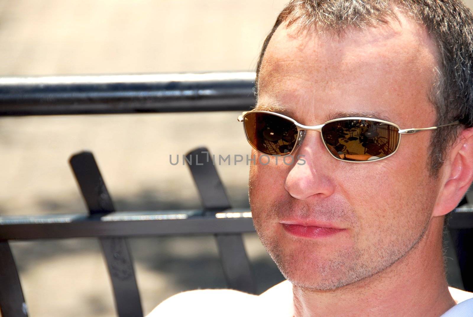 Portrait of a man wearing sunglasses in outdoor cafe