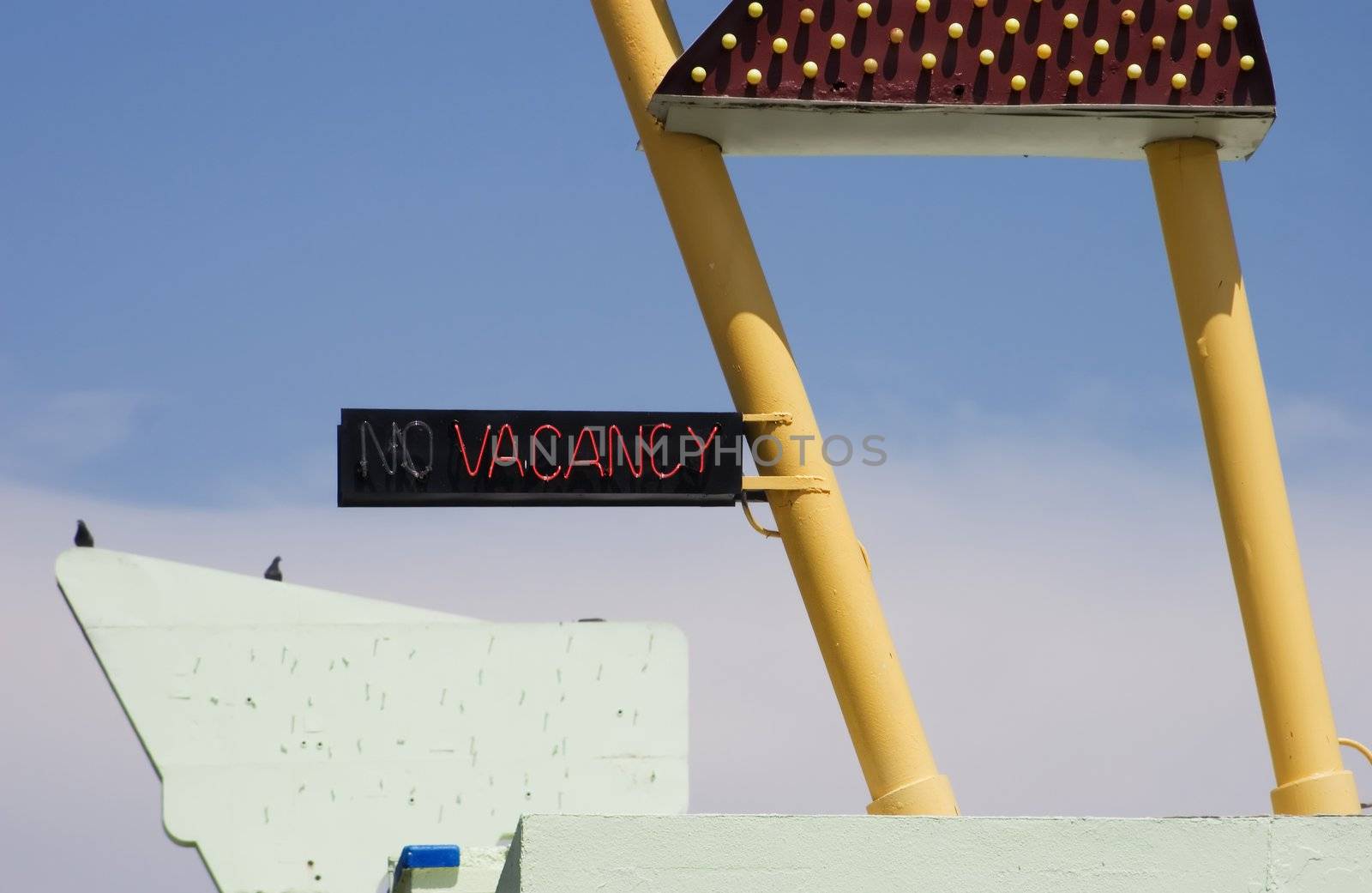 Neon "vacancy" sign on a funky old roadside motel.