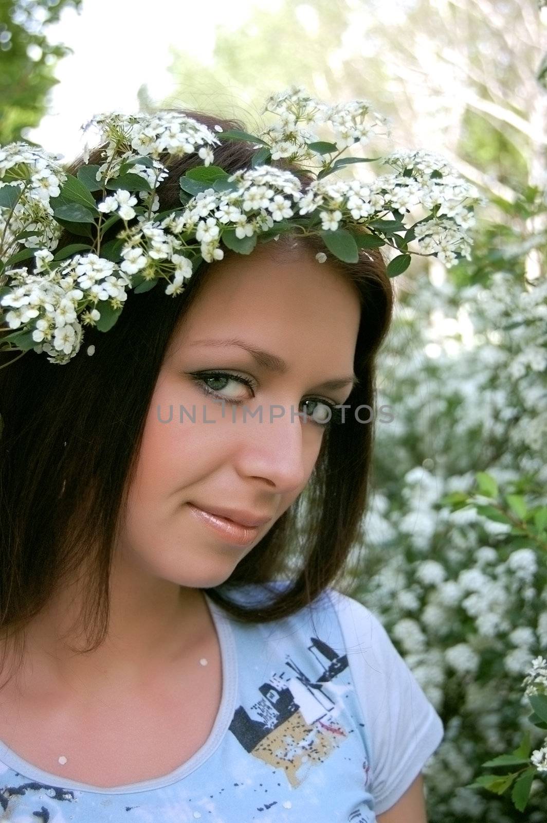 Beautiful girl with white flower diadem