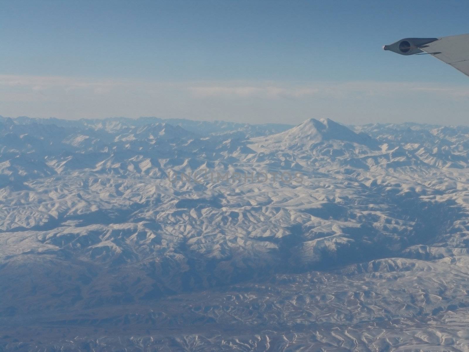 Snow-bound mountains from bird flight                            