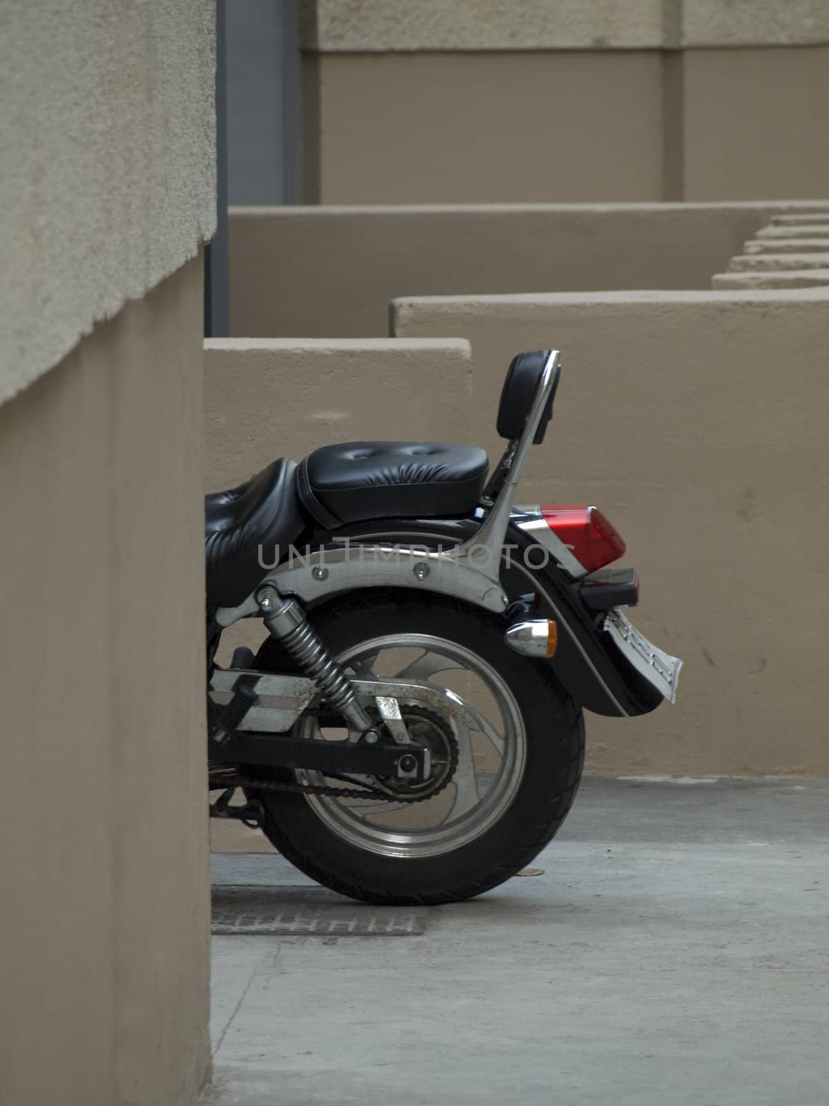 A generic motorcycle against an urban background