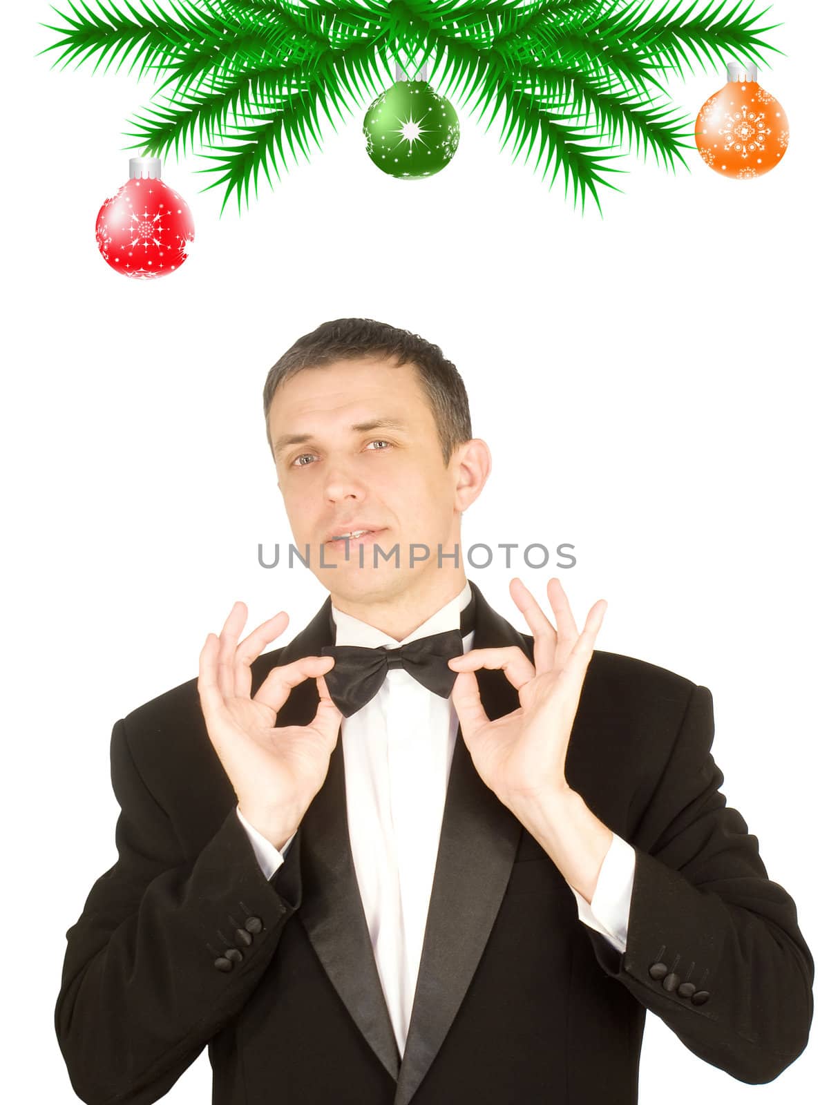 The happy man in a classical tuxedo in an anticipation of New Year's holidays