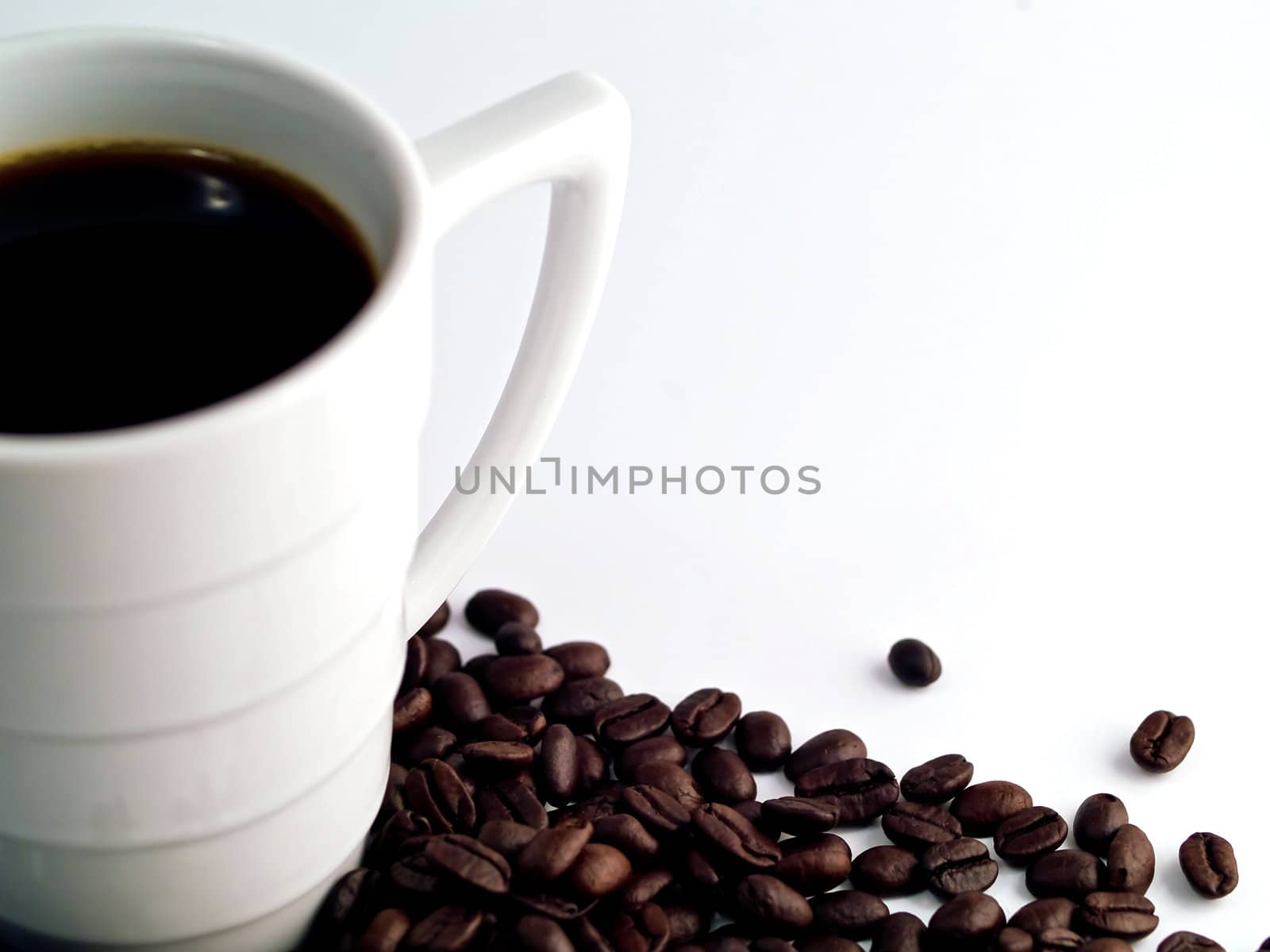 Coffee Cup and Beans on a White Background by Frankljunior
