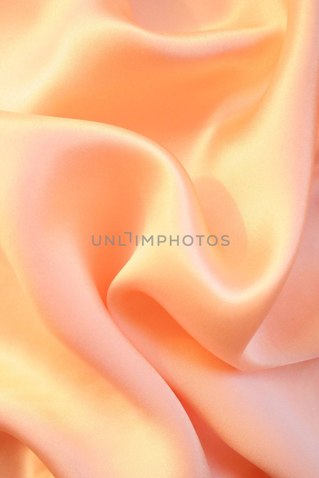 Smooth elegant golden pink silk as background by oxanatravel