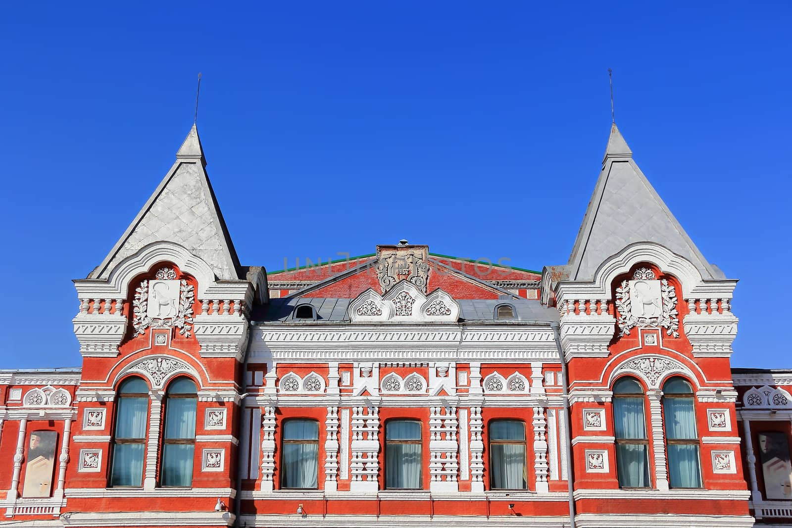 Town landscape with historic theater and blue sky