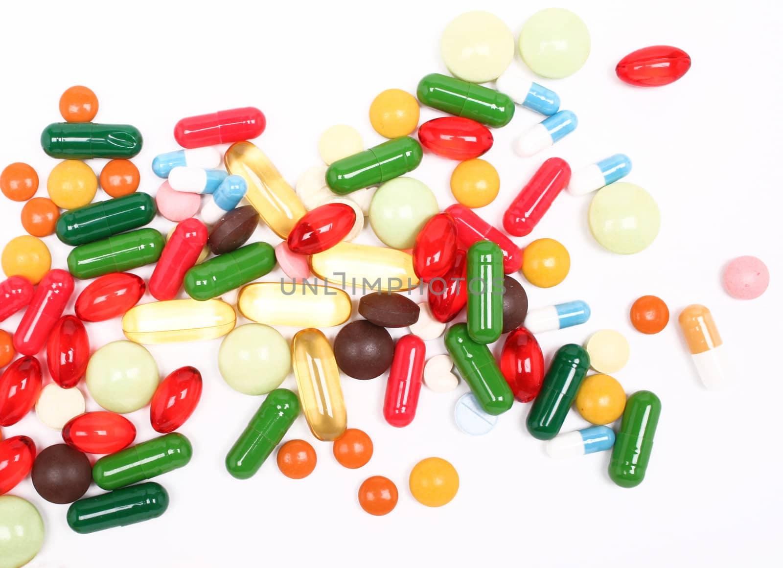 Different colorful pills on white background 