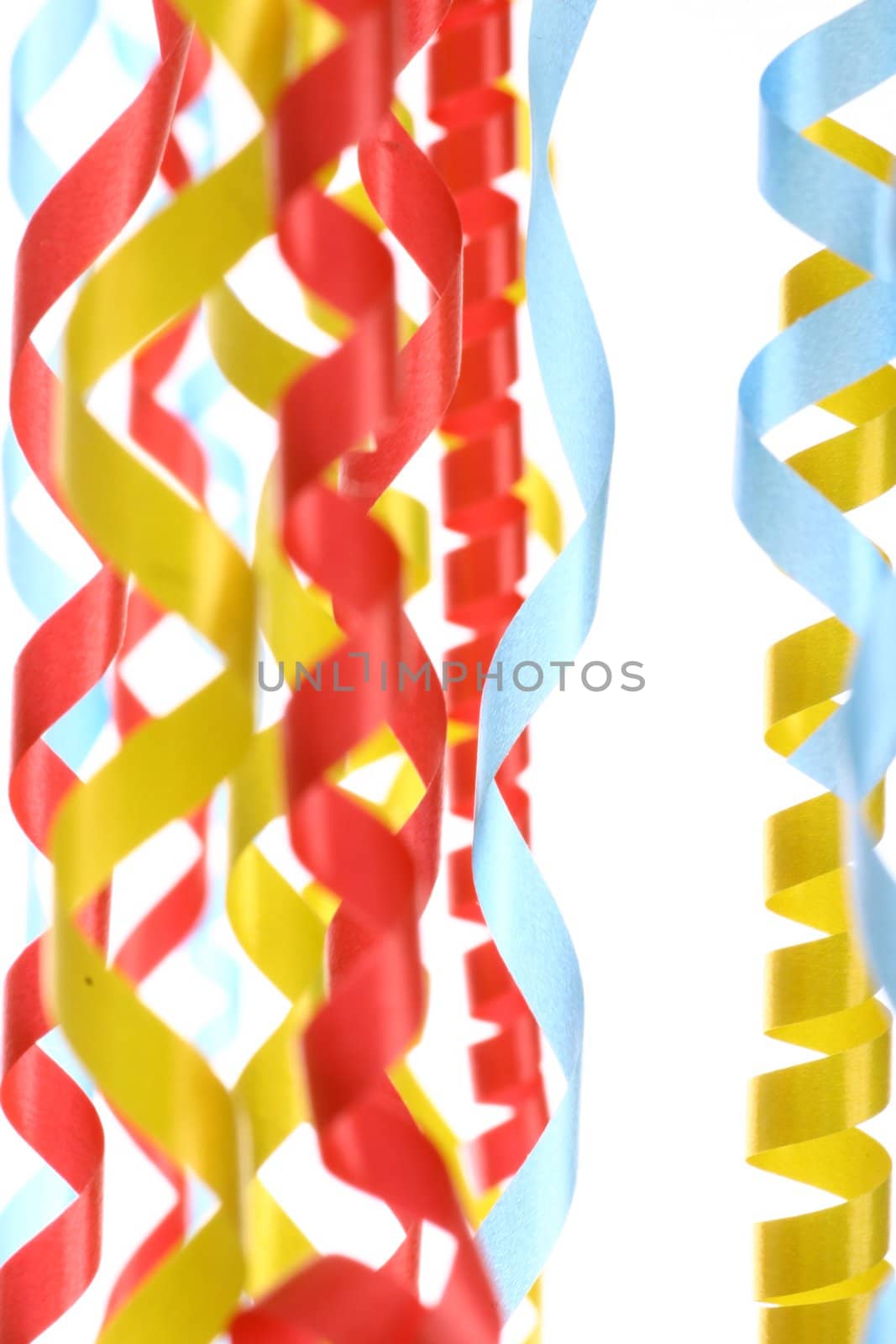 Celebratory streamer of red green and yellow color on a white background (look similar images in my portfolio)