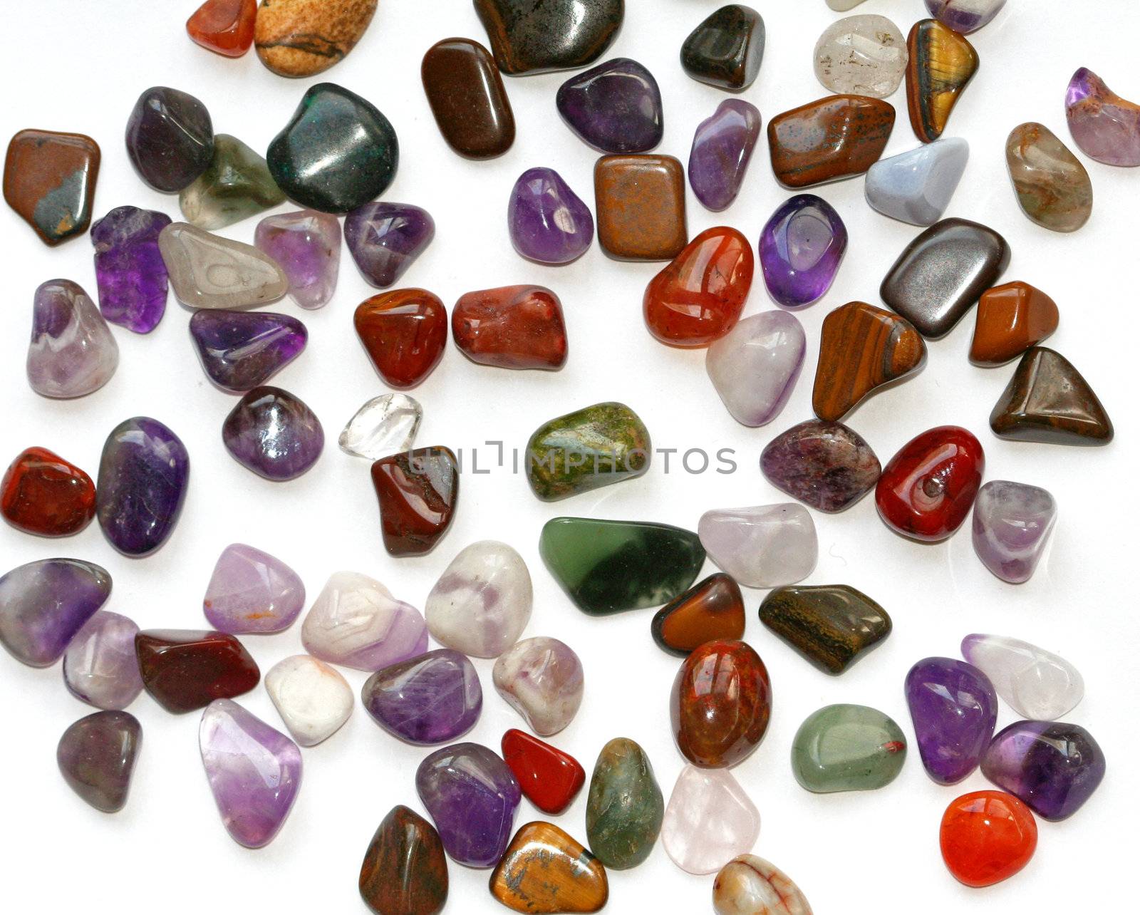 Colorful semiprecious stones on white background