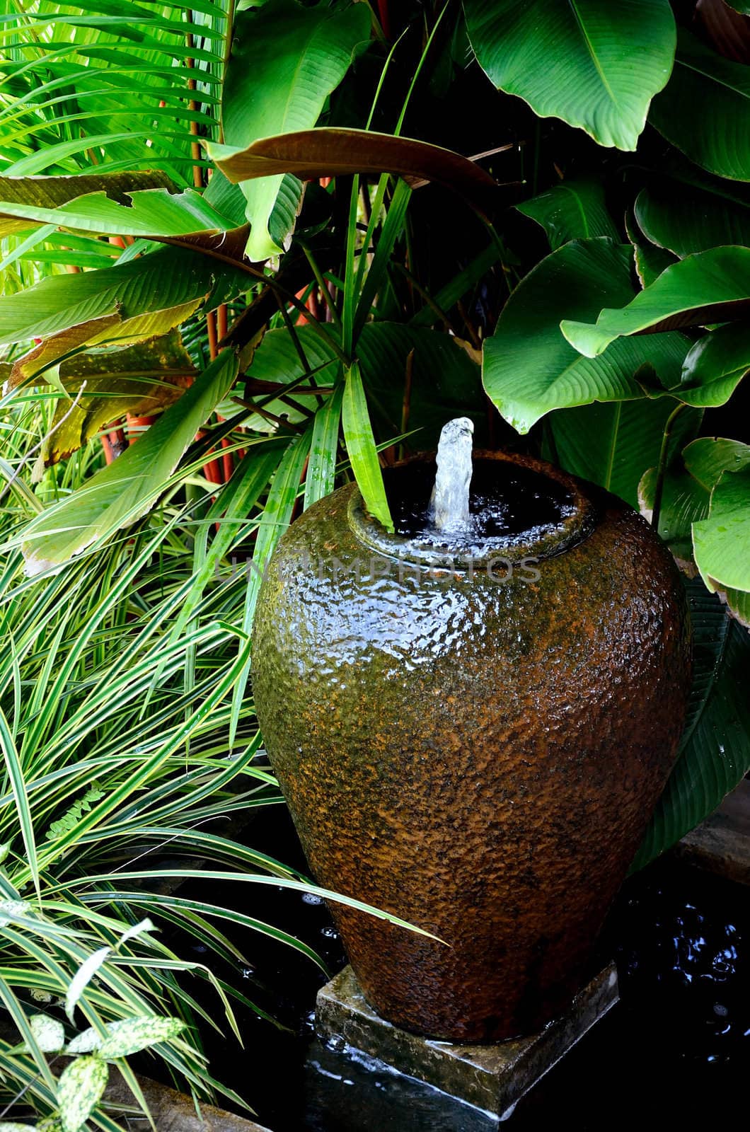 Fountain with earthenware in garden