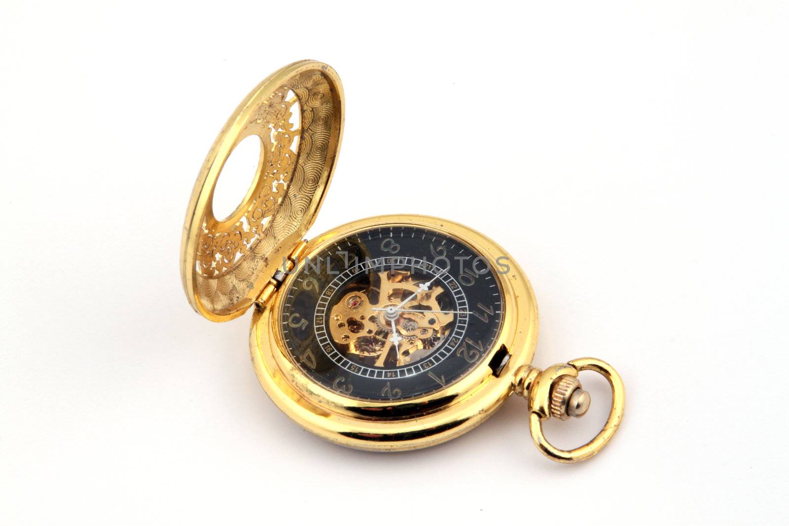 Gold pocket watch on a white background.