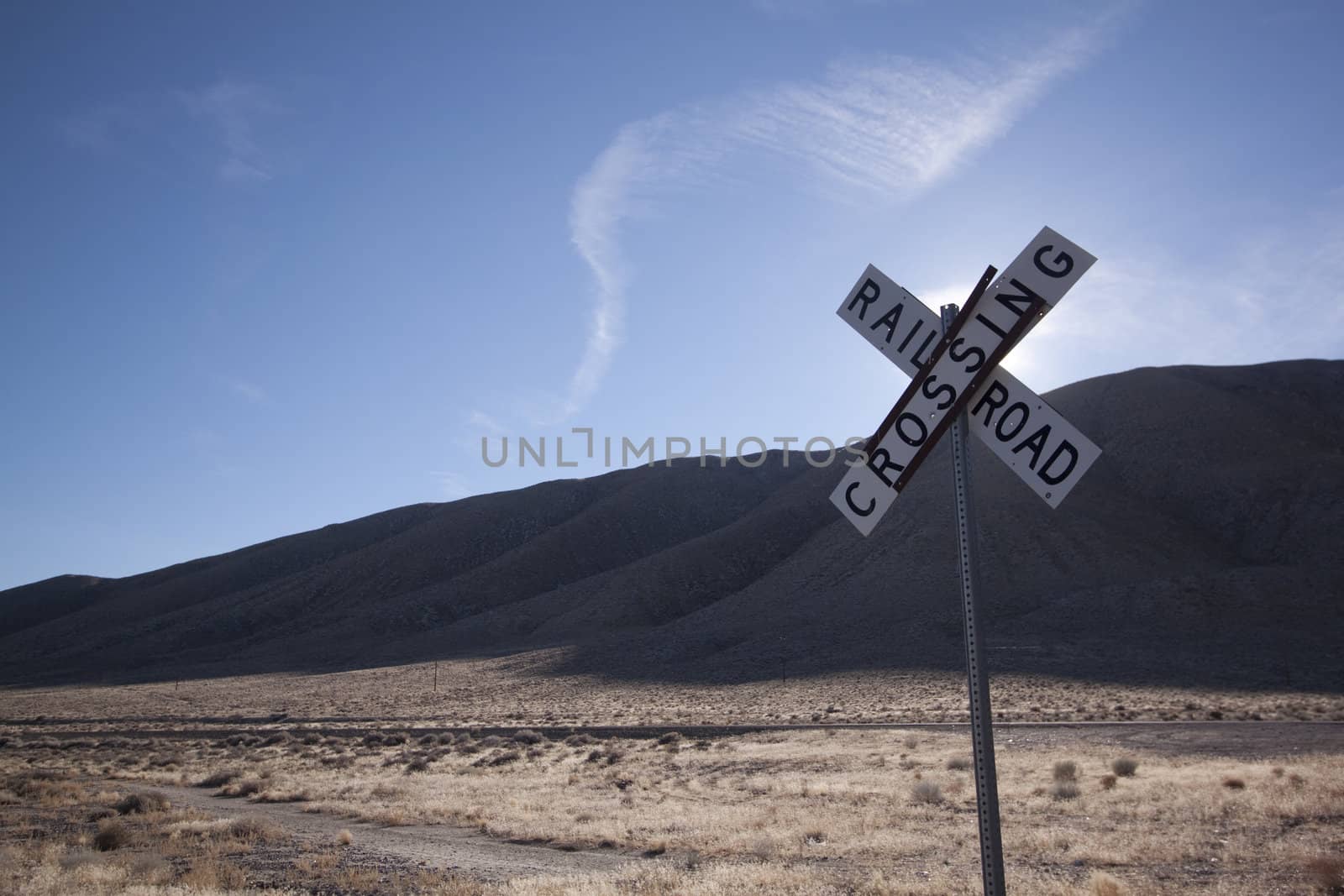 Railroad crossing tracks in the desert by jeremywhat