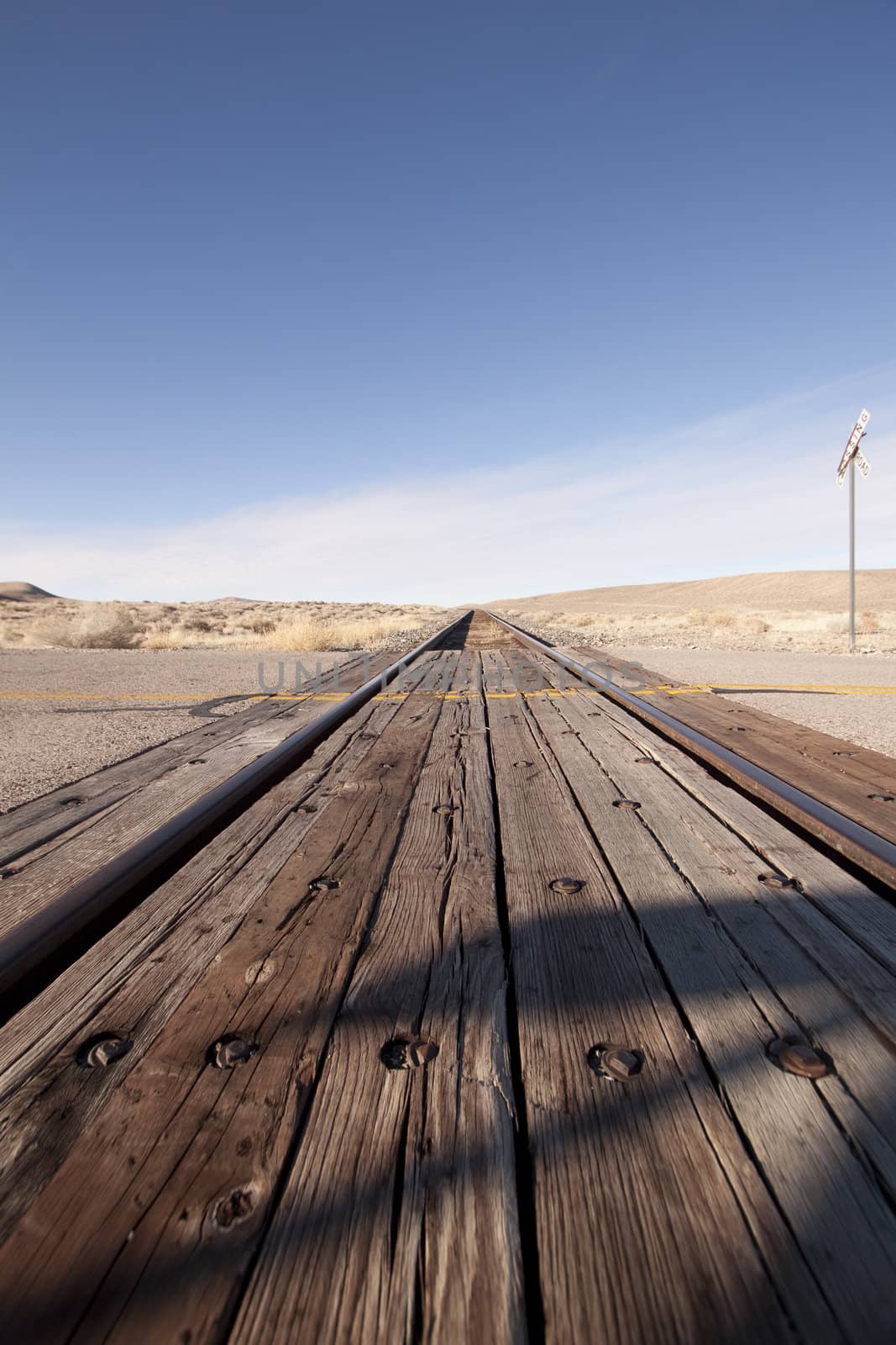 Railroad crossing tracks in the desert by jeremywhat