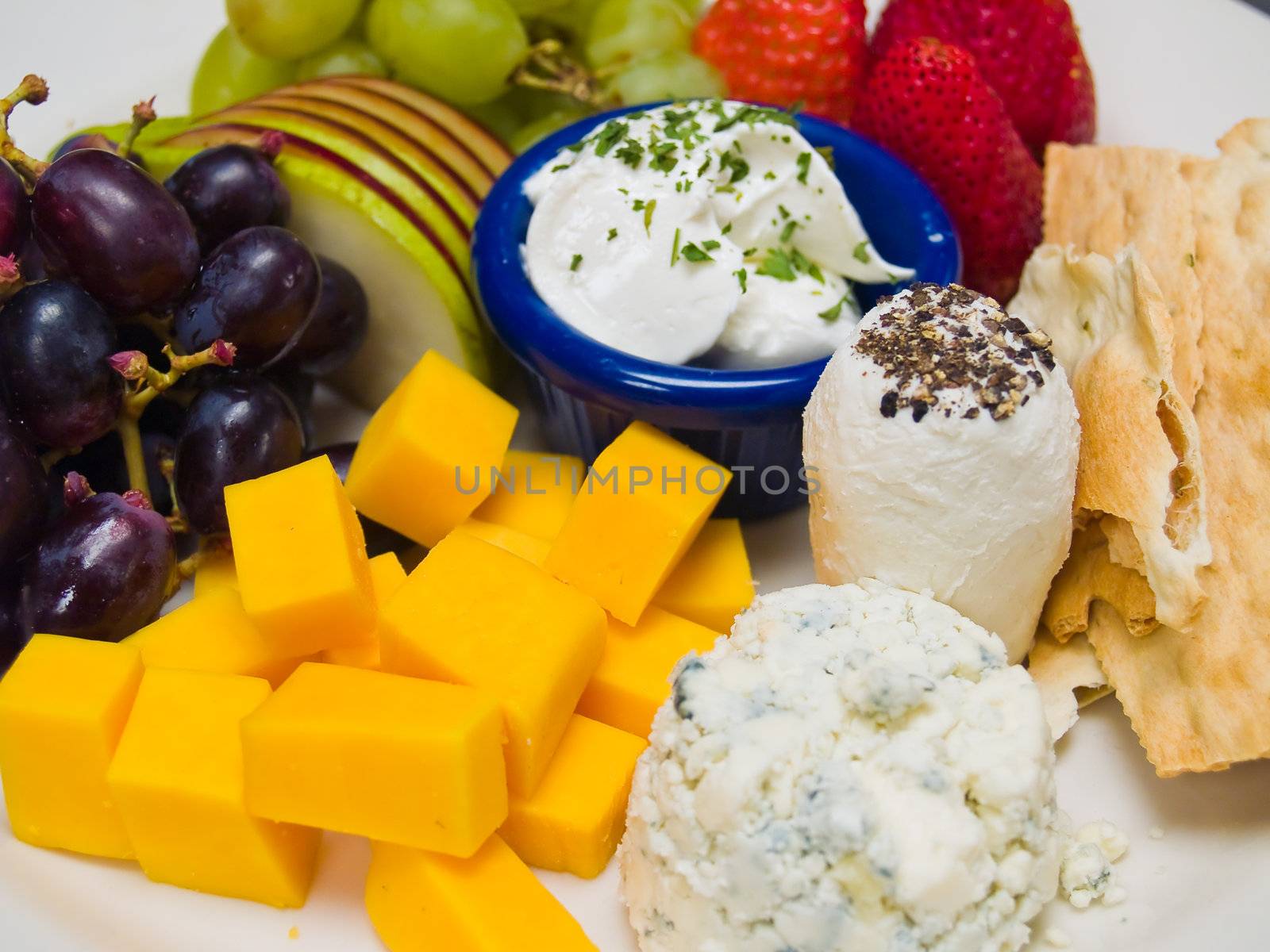 Cheese and Fruit Arranged on a Plate