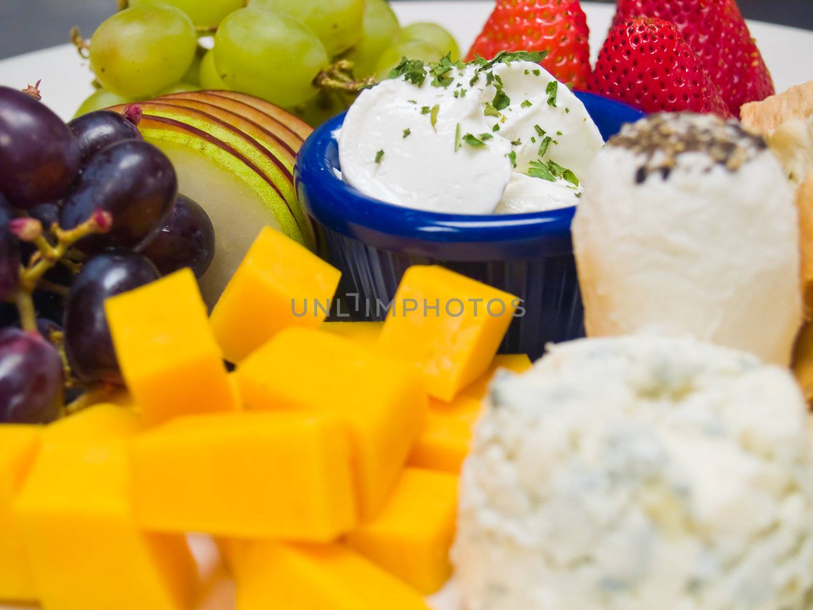 Cheese and Fruit Arranged on a Plate