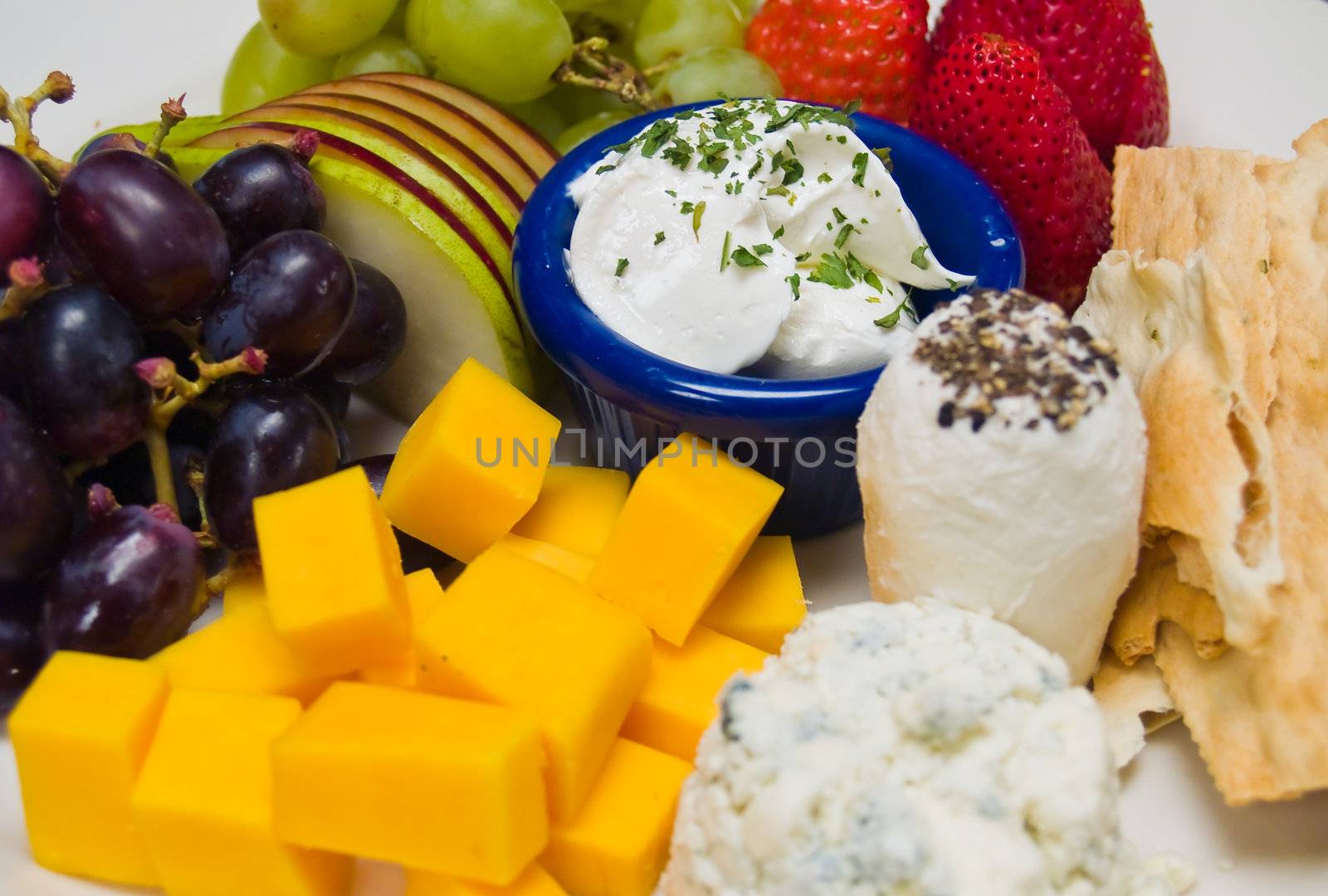 Cheese and Fruit Arranged on a Plate