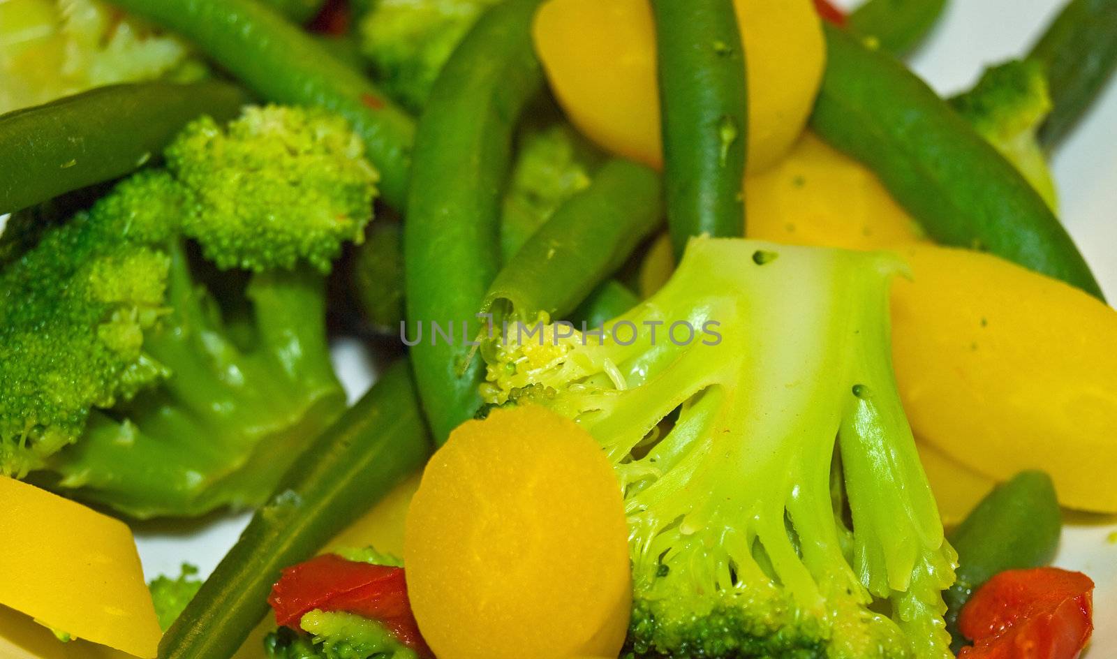 Fresh Steamed Vegetables Green Beans, Broccoli and Yellow Carrots