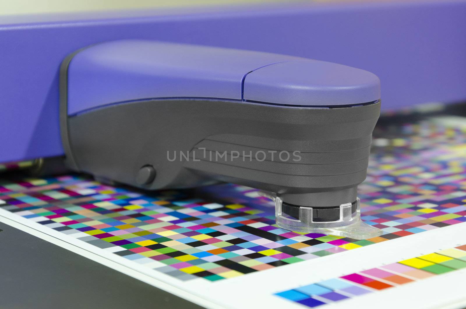 spectrophotometer measurment of color patches on Test Arch, print plant prepress department